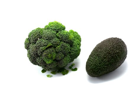 Fresh broccoli and avocado on the white bachgroundの写真素材