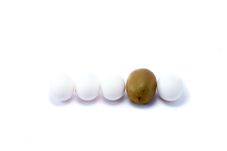 Eggs and kiwi on the white bakgroundの写真素材