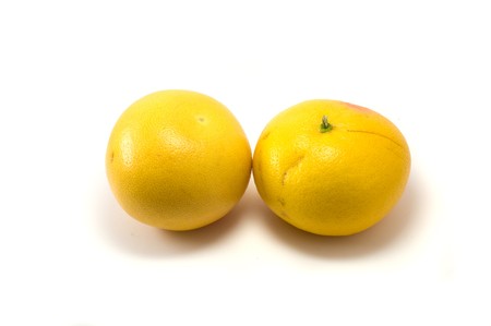 Two grapefruits on the white backgroundの写真素材