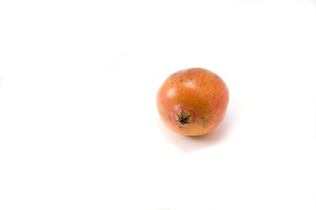 Ripe red pomegranate on the white backgroundの写真素材