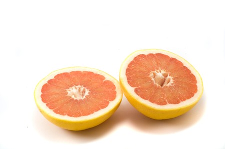 Two fresh grapefruts on the white backgroundの写真素材