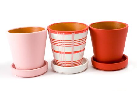 Three colored flower pots  isolated over whiteの写真素材