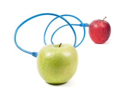 Conceptual shot with two apples and wiresの写真素材