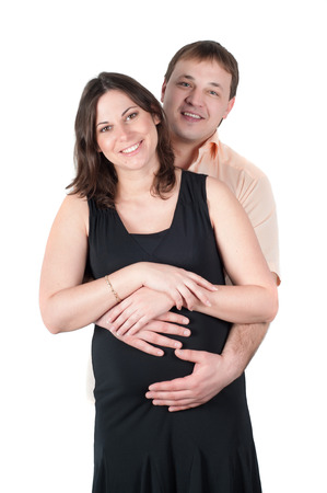 Shot of happy expectant parents isolated on whiteの写真素材