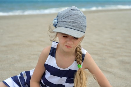 Cute little girl squintedの写真素材