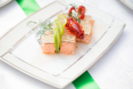 Fish dish and crayfish on the festive tableの写真素材