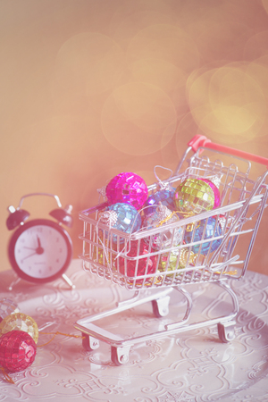 Christmas decorations in shopping trolley, retro tonedの写真素材