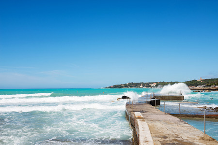 Beautiful azure sea and the rocky beachの写真素材