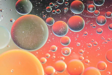 Oil drops in water. Defocused abstract psychedelic pattern image red and orange colored. Abstract...