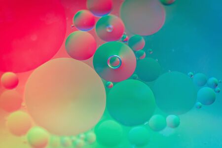 Oil drops in water. Abstract defocused psychedelic pattern image rainbow colored. Abstract background with colorful gradient colors. DOFの写真素材