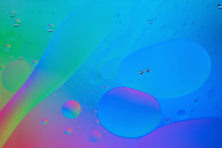 Oil drops in water. Abstract defocused psychedelic pattern image rainbow colored. Abstract...