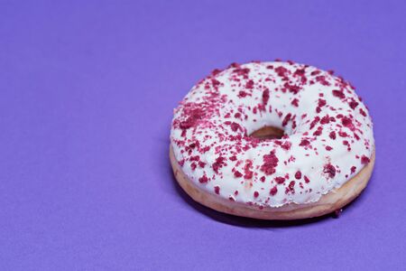 Macro shoot of white donut over blue backgroundの写真素材