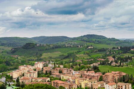 Beautiful spring froggy landscape in Tuscany countryside, Italyの写真素材
