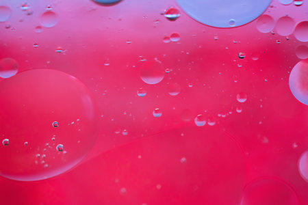 Oil drops in water. Defocused abstract psychedelic pattern image red colored. Abstract background...