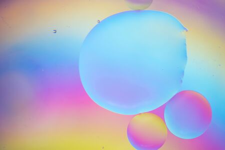 Oil drops in water. Abstract psychedelic pattern image rainbow colored. Abstract background with colorful gradient colors.の写真素材