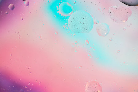 Defocused pastel colored abstract background picture made with oil, water and soap