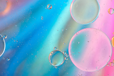 Defocused pastel colored abstract background picture made with oil, water and soap