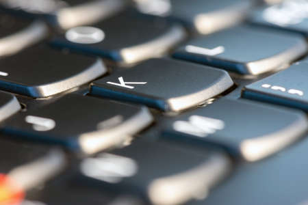 Macro shot of black keyboard focus on K keyの写真素材