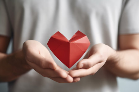 Hands holding red heart. Health care. Organ donation. World Heart Day. World Health Day. World Mental Health Day.の素材