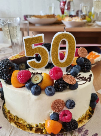 A 50th birthday cake with fruitの写真素材