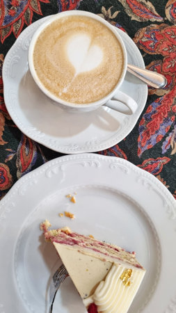 Cake and coffee on a plateの写真素材