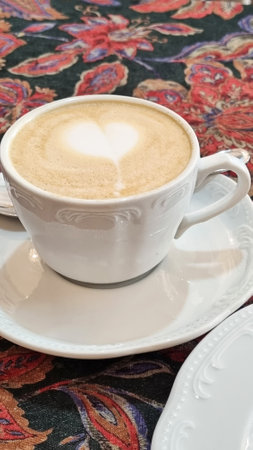 A cup of cappuccino on a saucerの写真素材
