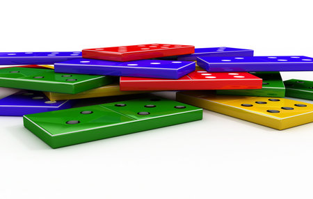 Scattered colored shiny bones dominoes on light backgroundの写真素材