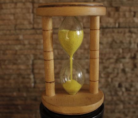 Sandglass on stone background