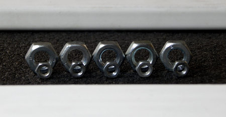 Lines of screw nuts studio isolatedの写真素材