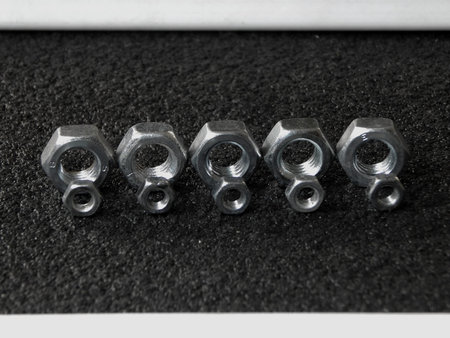Lines of screw nuts studio isolated