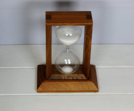 Sandglass over white background studio shot