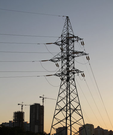 Pylon and wires of high voltage power line over skyの写真素材