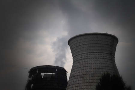 Thermal power plant pollutes the air at industrial areaの写真素材