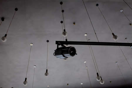 Lighting technology in studio with moving track spotlights and ceiling lampsの写真素材