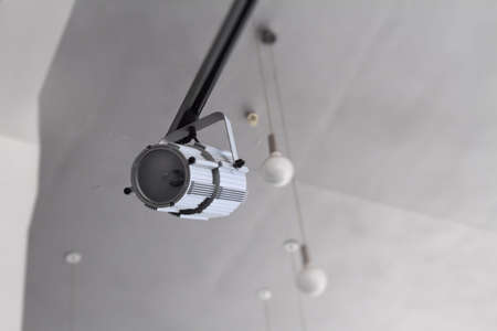 Lighting technology in studio with moving track spotlights and ceiling lampsの写真素材