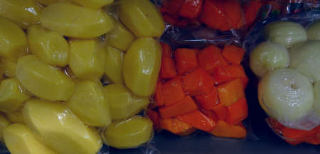 Long term storing food. Vegetables in vacuum packageの写真素材