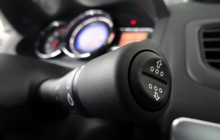 Wiper switch close up shot with soft focus on dashboard in car interior