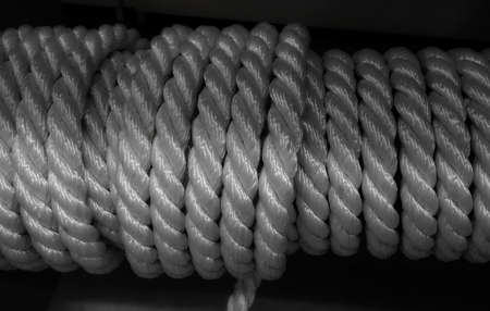 Roll of white hawser rope closeup stock photoの写真素材