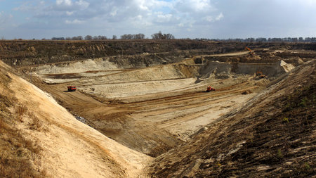 Extractive machines works in open quarry to extract building materials