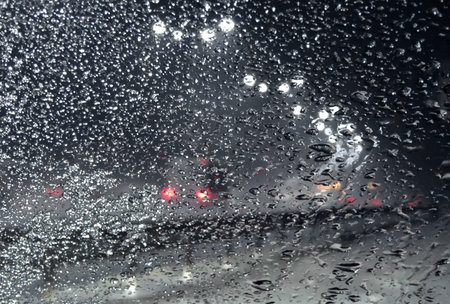 Frozen Snow On The Windshield Of Car On The Roadside At Night