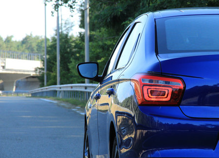 Rear lights of blue car is ready for driving on the highwayの写真素材