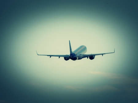 Airplane retract undercarriage after taking offの写真素材