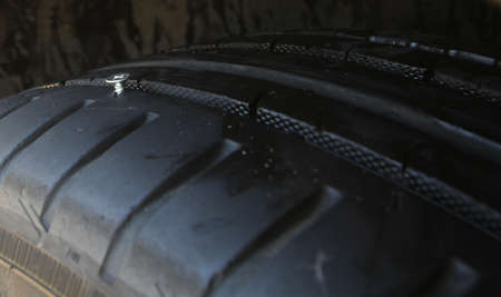 Metal Screw Sticking Out From Car Tireの写真素材