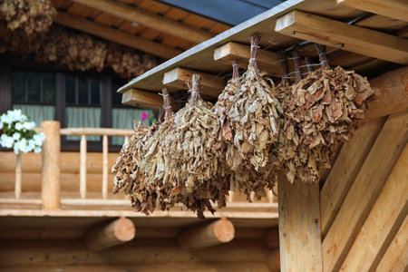Outdoors View Of Logs Sauna With Brooms For Steam Bathの写真素材