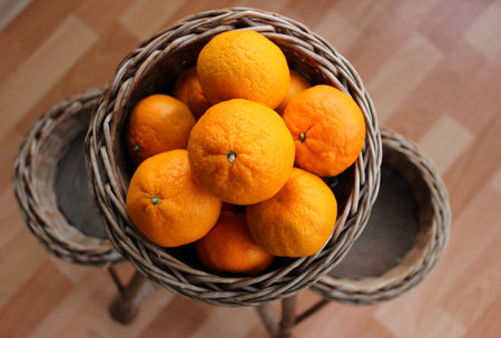 Fresh Tangerines In A Handmade Rattan Pot Stock Photoの写真素材