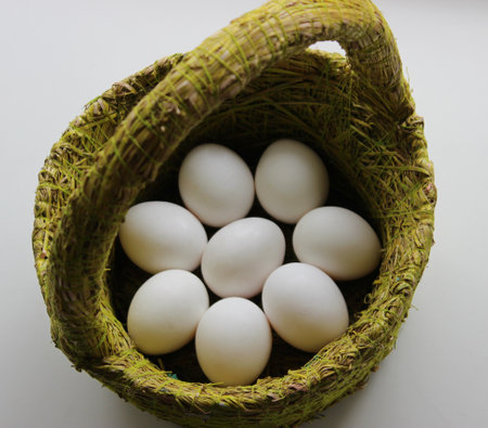 Eco-style Easter basket with clean chicken eggs insideの写真素材
