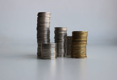 Variety Denominations Coins In A Different Columns Isolated On White For Financial Or Investment...