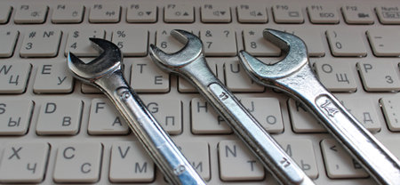 Computer Repairing Illustration. Hex Head Spanners On White Keys Of Laptop Keyboardの写真素材