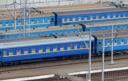 Passenger railway carriages stand on sidetracks waiting for a train to be formedの写真素材