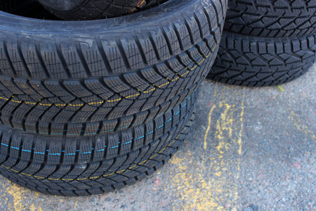 Variety Studless Car Tires For Mud And Snow In A Stack On The Road. Seasonal Tires Change Image